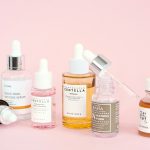 blog post banner of skincare products with a pastel pink background