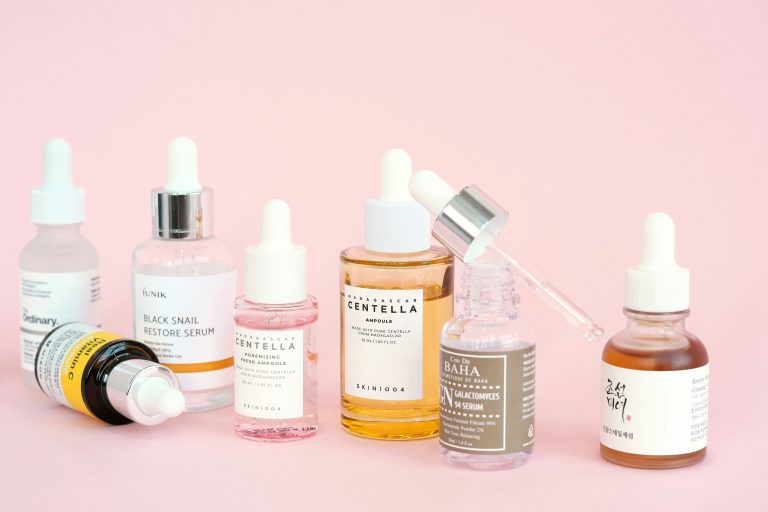 blog post banner of skincare products with a pastel pink background